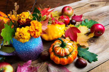 Autumn flowers, apples and pumpkins seasonal arrangement