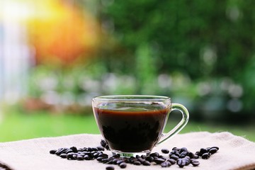 Morning coffee closeup outdoor garden blur background