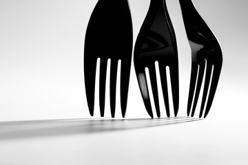 Fork background / A fork is a tool consisting of a handle with several narrow tines on one end