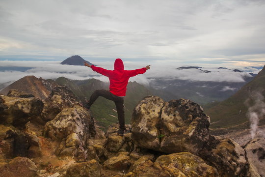 Freedom man standing on top of Mount Sibayak, Indonesia