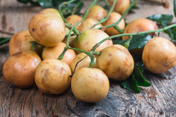 Rambeh fruit isolate on wooden table background

