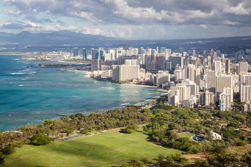 Downtown Waikiki City / View of downtown Waikiki skyline from Diamond Head Monument summit viewpoint. Many buildings and resorts line the Waikiki beach front coastline.