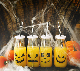 Orange coctail in bottle for fall and halloween parties