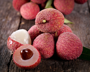 lychee fruit on wooden background © nipaporn