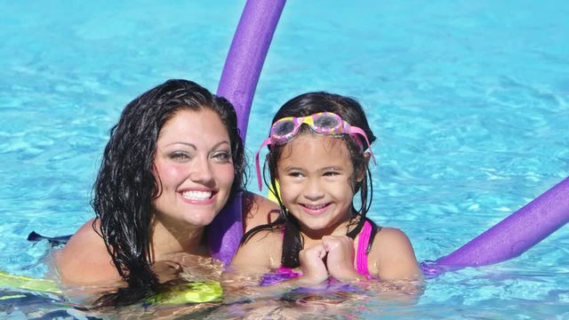 Mother and daughter at the pool