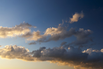 clouds of white and gray in the sunlight close-up