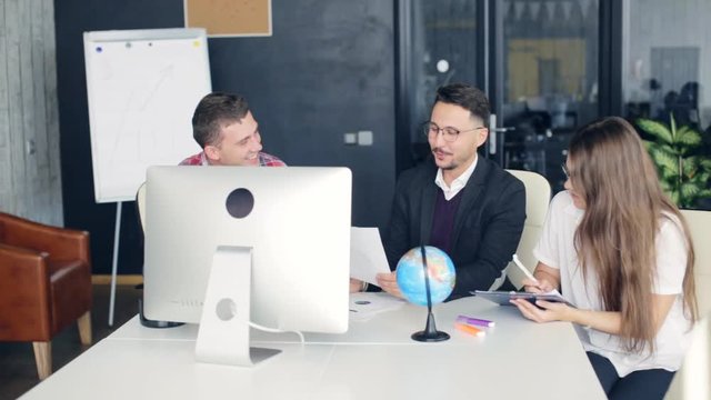 Group of young business people working together in creative office