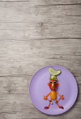 Cook made with vegetables on wooden background