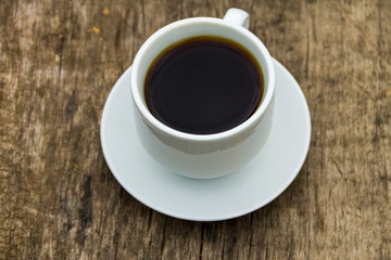 Cup of coffee on wooden table