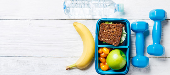 Picture of apple, sandwich, tomato in box, dumbbell