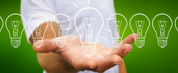 Businessman holding a sketch lightbulb