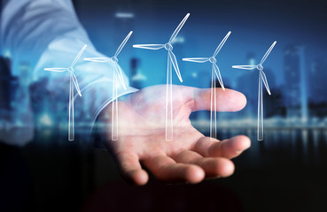 Businessman holding renewable energy sketch