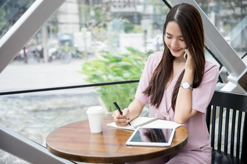 Young asian lady working in coffee shop