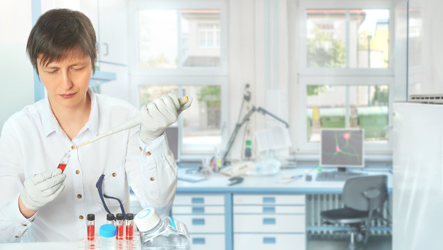 Panoramic toned image of female scientist in the lab