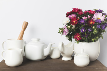 Kitchen utensils and flowers