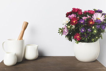Kitchen utensils and flowers