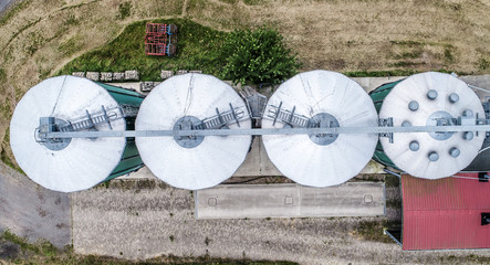 Silos in a field for storing grain, aerial view