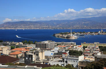 Port of Messina with the gold Madonna della Lettera statue. Sicily. Italy
