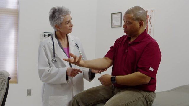 Male patient telling doctor about his ailments and pains