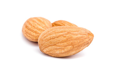 Group of almonds isolated on white background