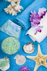 Fototapeta na wymiar Spa treatments on a blue towel