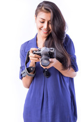 pretty woman photographer holding camera and excite with picture over white background. with clipping path