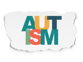 Medicine concept: Autism on Torn Paper background