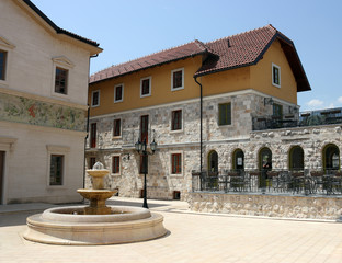 Fototapeta na wymiar stone fountain on square Andricgrad Visegrad Bosnia