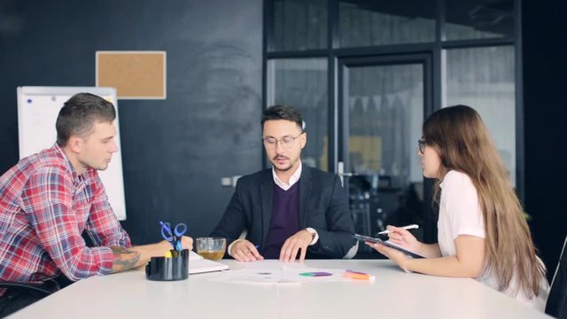 Group of business people working together in creative office