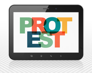 Politics concept: Tablet Pc Computer with Protest on  display