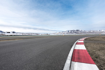 empty asphalt road with beautiful snow mountains