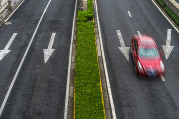 blurred car speeding on highway.
