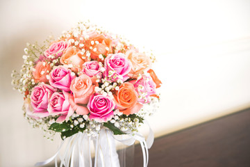 Bouquet of colorful roses in glass jars.
