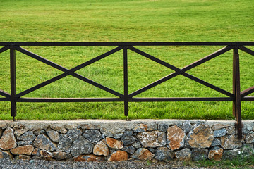 Wooden fence on the grass