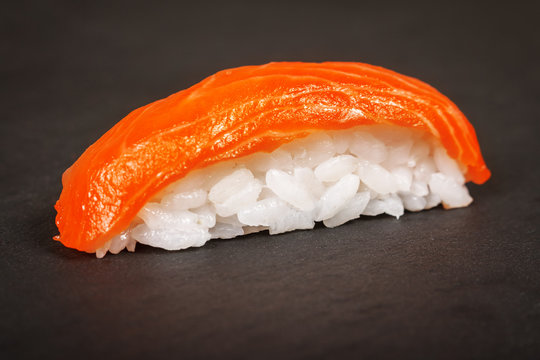 Nigiri sushi on a slate plate