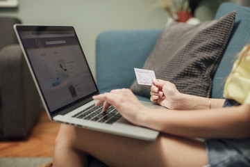 Woman Using Credit Card for Online Payment