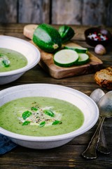 green vegetable cream soup puree with zucchini and basil