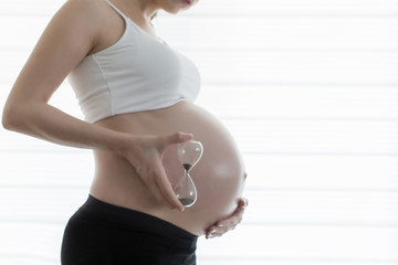 Pregnant woman with hourglass