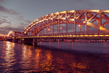 Fototapeta na wymiar Night view of the Bolsheokhtinsky Bridge.