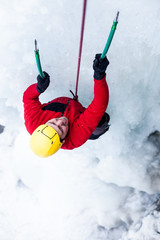 The climber climbs on ice.