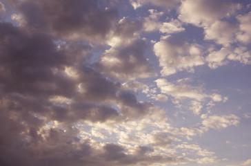 cumulus white clouds against a beautiful blue sky, bizarre patte