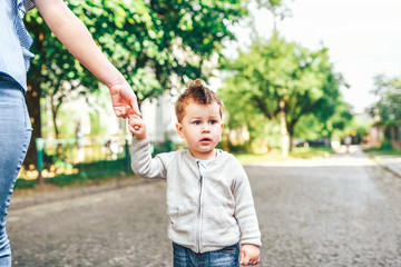 Mother with her little son outdoor in the park