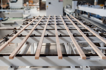 Wood sticks on a furniture manufacture production machine