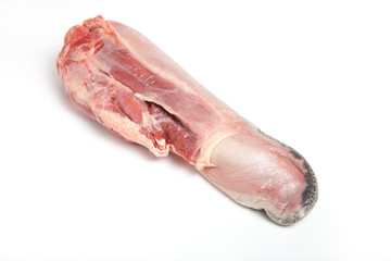 Fresh raw beef tongue on a light background
