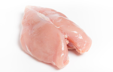 Raw chicken breast on light background