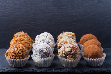 Set of different kinds of homemade chocolate truffles. Selective focus. Shallow depth of field