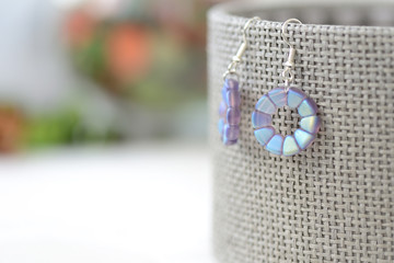 Round beaded earrings blue color close up