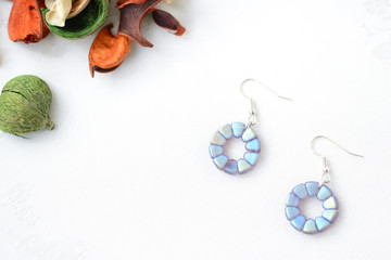 Round beaded earrings blue color close up