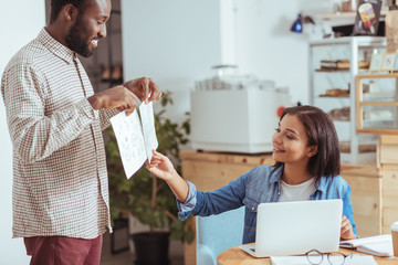 Smiling woman picking one project design concept