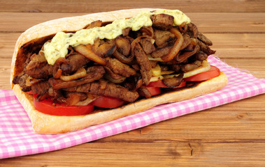 Fried beef and onion filled sandwich sub roll